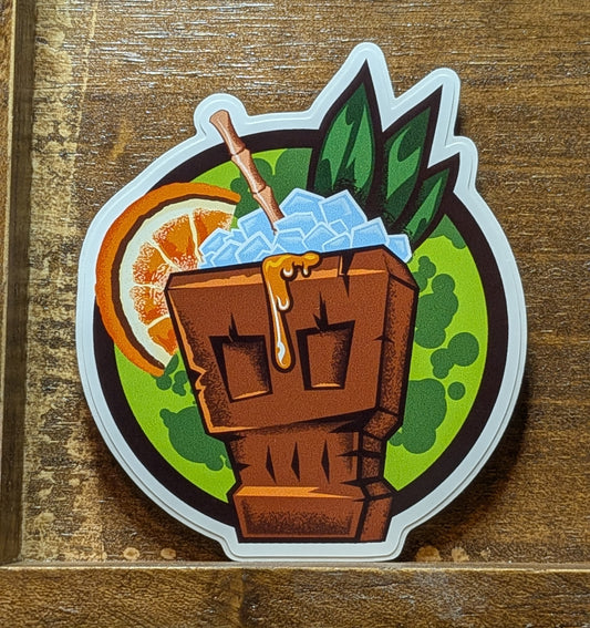 Sticker of a tiki mug with a cocktail on a wooden surface